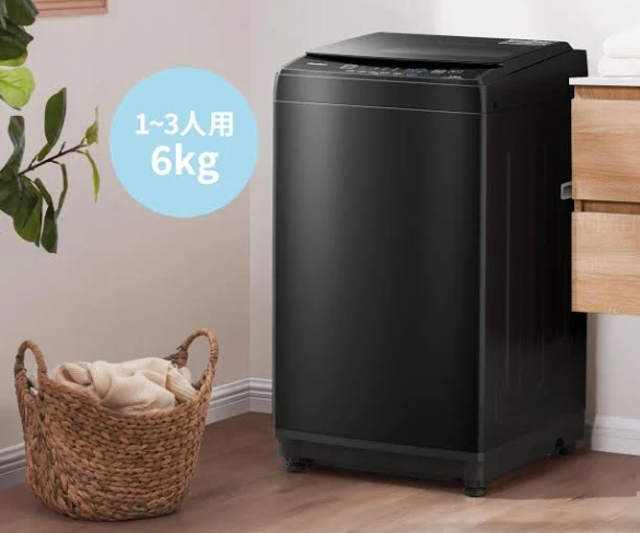 compact pulsator washer front view, black body with visible top control panel, designed for small spaces like apartments and dorms