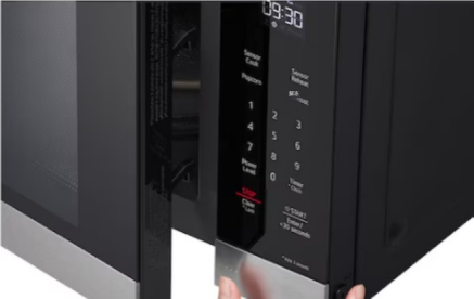 Smart sensor microwave control panel close-up, Sensor Cook button prominently displayed, highlighting automatic cooking adjustment feature