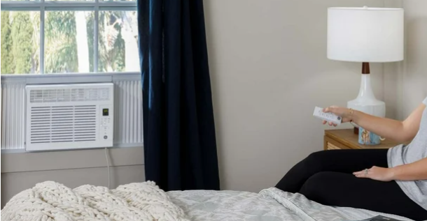 window AC installed in bedroom window, suitable for bedrooms, offices, or dorms up to 150 sq ft